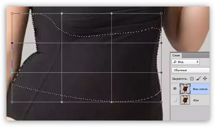 Grid con marcadores da función de deformación cunha diminución da cintura en Photoshop