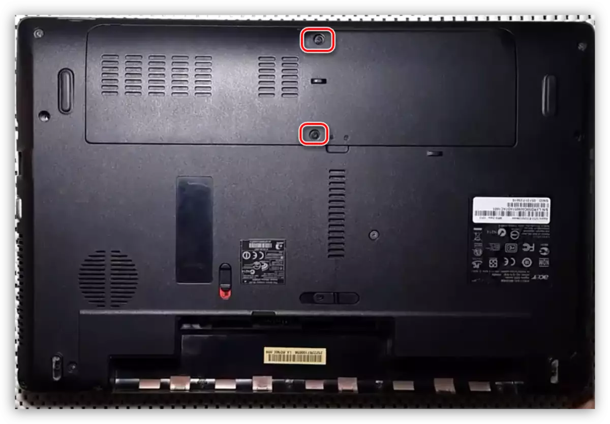 Revealing screws on the cover of the disc and memory compartment on the Acer Aspire 5253 laptop