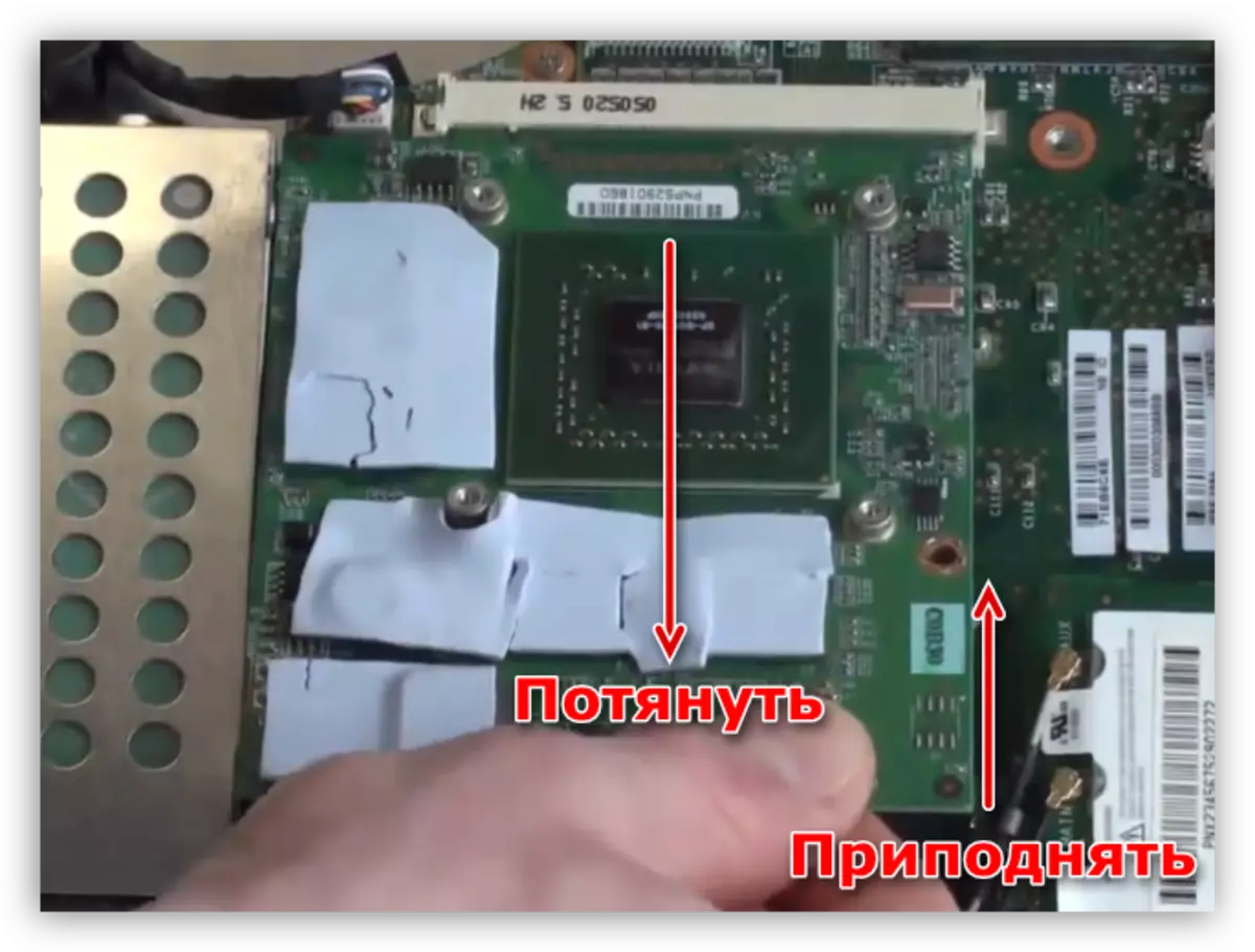 Removing the discrete video card from the connector in the laptop