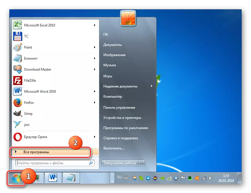 Anar a través de tots els programes en el botó Inici a Windows 7